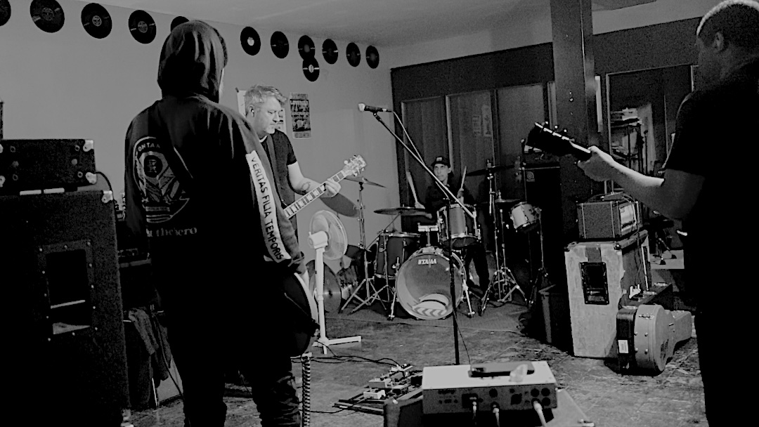 grainy black and white photograph of the band